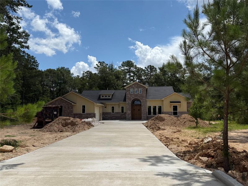 Front exterior of a new home in , Splendora, TX, highlighting curb appeal (Image 8). Front exterior of a new home in , Splendora, TX, highlighting curb appeal (Image 8).