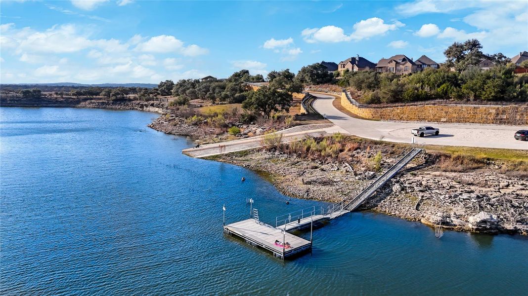 A private wooden dock with ramp access sits along the rocky edge of this expansive lake. A private wooden dock with ramp access sits along the rocky edge of this expansive lake.