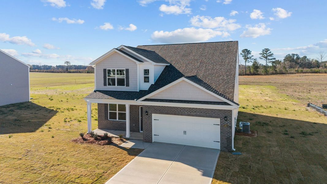 Front exterior of a new home in Beaver Dam Crossing, Bailey, NC, highlighting curb appeal (Image 22). Front exterior of a new home in Beaver Dam Crossing, Bailey, NC, highlighting curb appeal (Image 22).