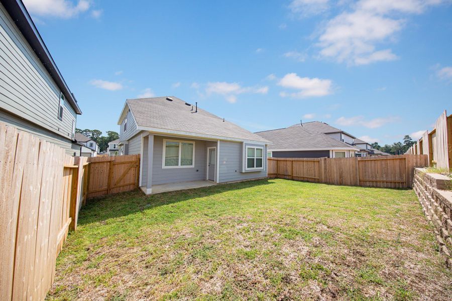 Exterior details and patio area of a home in River's Edge, Conroe (Image 2).