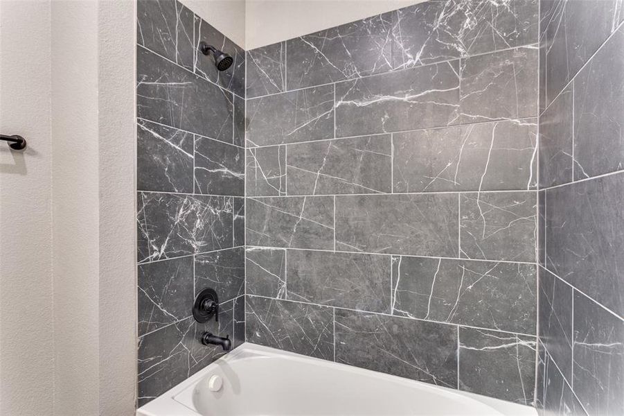 Bathroom with bathtub / shower combination Bathroom with bathtub / shower combination