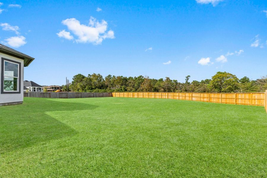Front exterior of a new home in , Spring, TX, highlighting curb appeal (Image 2). Front exterior of a new home in , Spring, TX, highlighting curb appeal (Image 2).