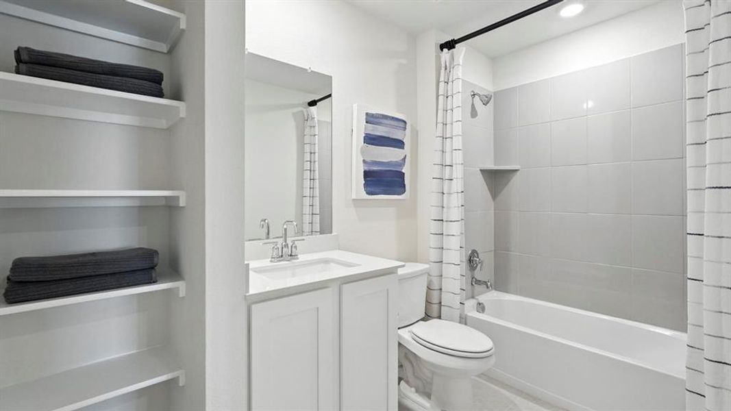 Bathroom with shower / bath combination with curtain, vanity, and recessed lighting