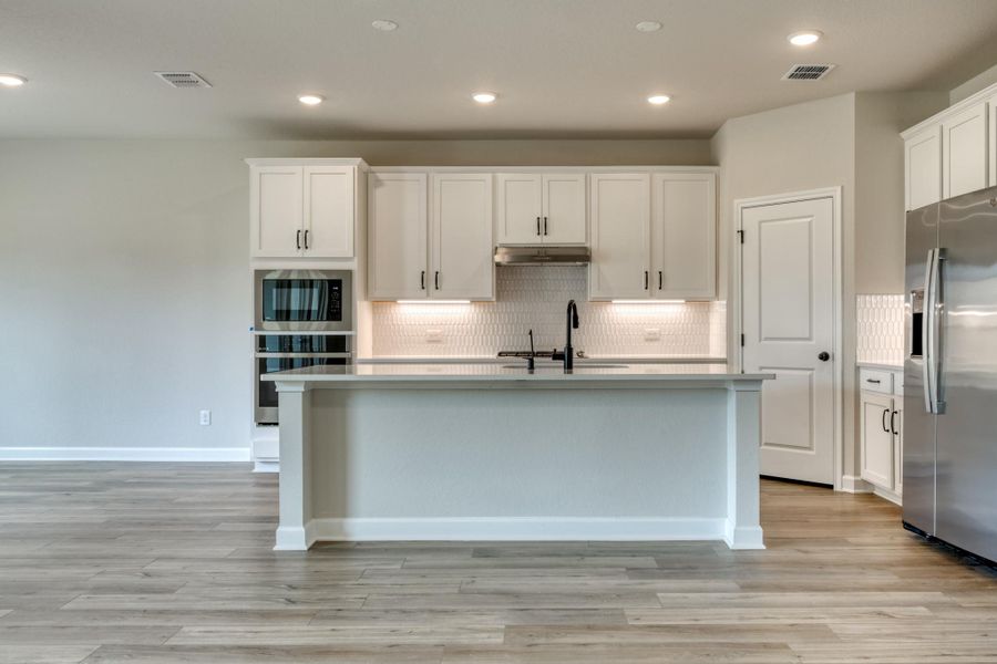 Representative furnished interior of a home built from the Kennedy by Ashton Woods in The Preserve at the Wilder, Adkins (Image 13).