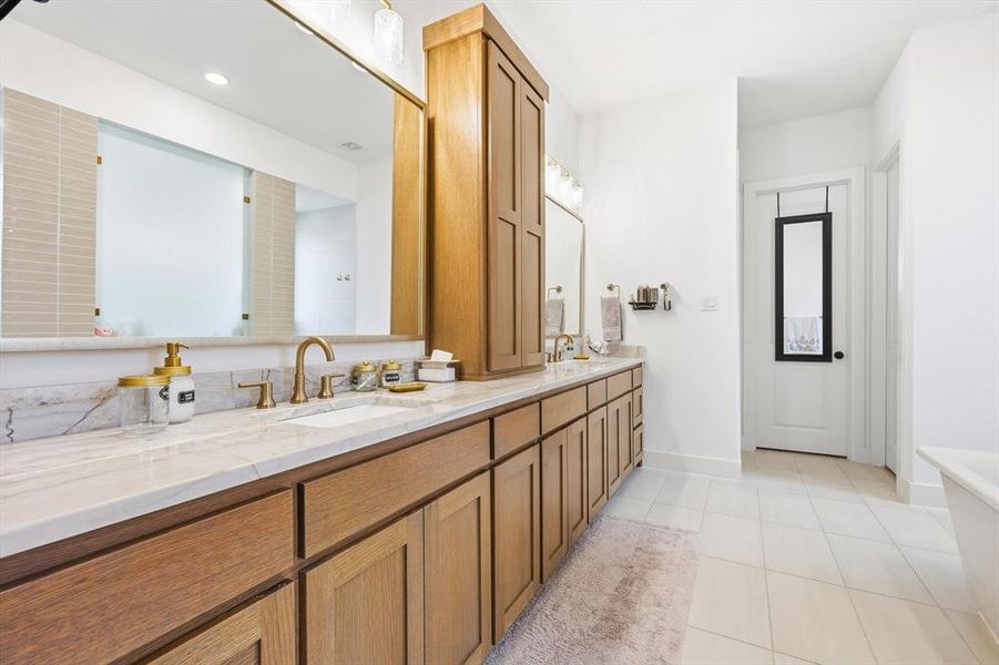 Dual sinks, double shower, and separate his and her closets Dual sinks, double shower, and separate his and her closets