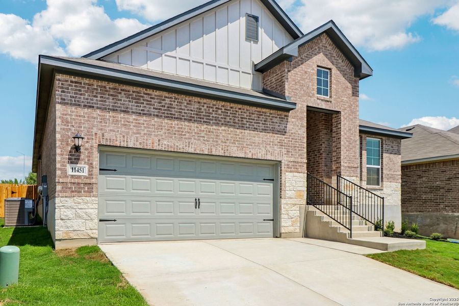Front exterior of a new home in Sagebrooke - Classic Series, San Antonio, TX, highlighting curb appeal (Image 26).