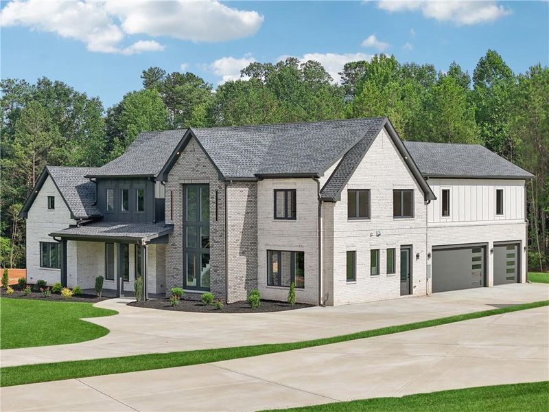 Front exterior of a new home in , Braselton, GA, highlighting curb appeal (Image 47).