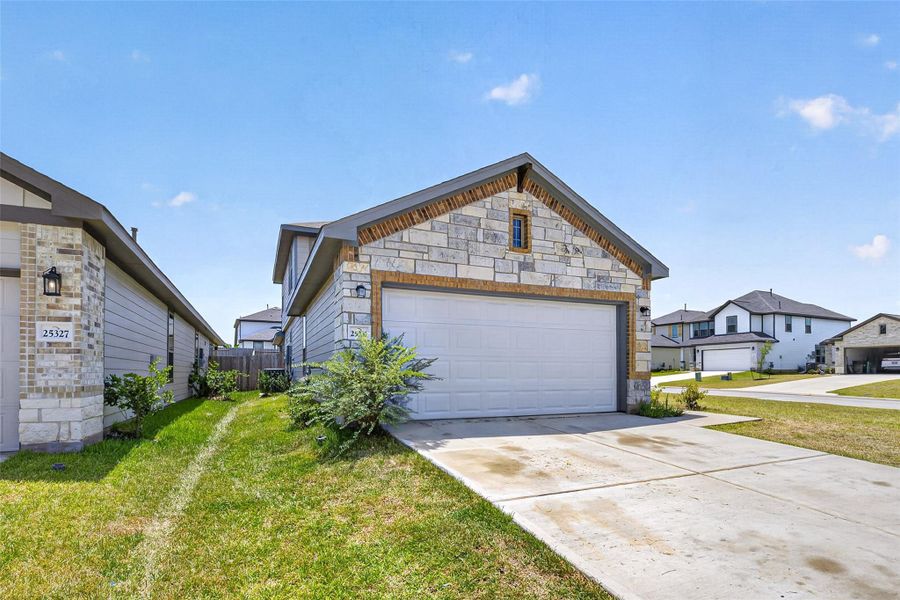 Front exterior of a new home in , Montgomery, TX, highlighting curb appeal (Image 24).