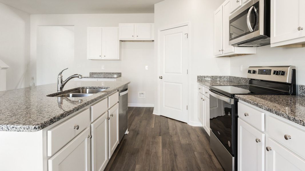 Representative furnished interior of a home built from the HAYDEN by D.R. Horton in Sidbury Station, Castle Hayne (Image 7).