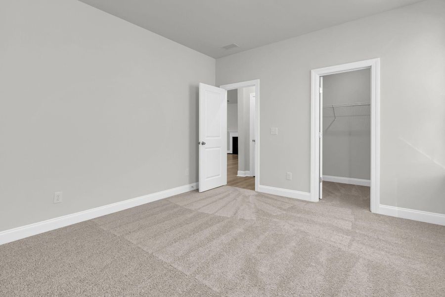 Spacious, unfurnished interior of a new home in Tidewater at Lakes of Cane Bay, Summerville (Image 22).