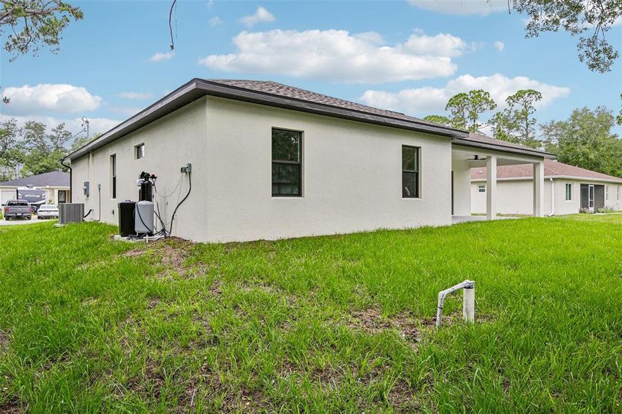 Exterior details and patio area of a home in , North Port (Image 24).