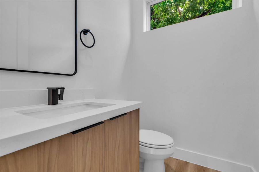 The second-floor half bath is conveniently located and features a clean, functional design for guests and everyday use. The second-floor half bath is conveniently located and features a clean, functional design for guests and everyday use.