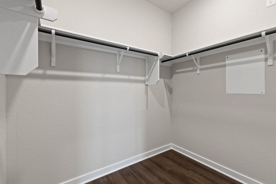 Walk-in closet in Primary Bedroom Walk-in closet in Primary Bedroom