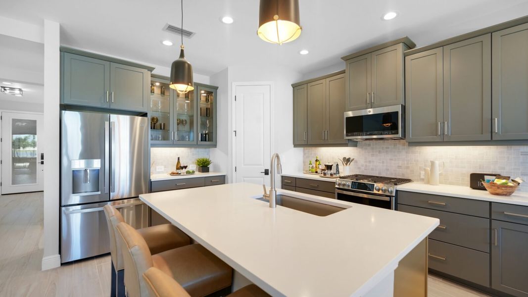 Representative furnished interior of a home built from the Meadow Brook by Neal Communities in SkySail, Naples (Image 13).
