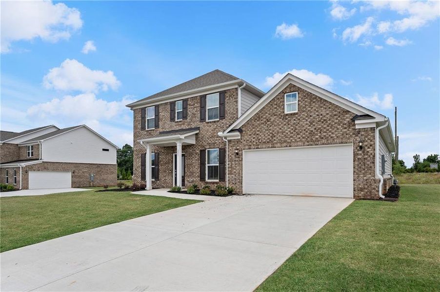 Front exterior of a new home in Anderson Point Estates, McDonough, GA, highlighting curb appeal (Image 21).