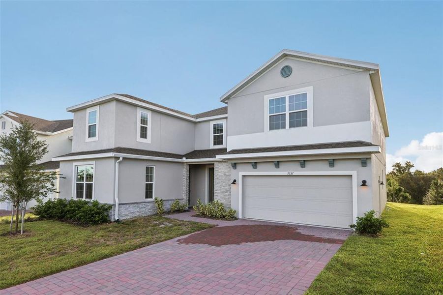 Front exterior of a new home in , Groveland, FL, highlighting curb appeal (Image 20). Front exterior of a new home in , Groveland, FL, highlighting curb appeal (Image 20).