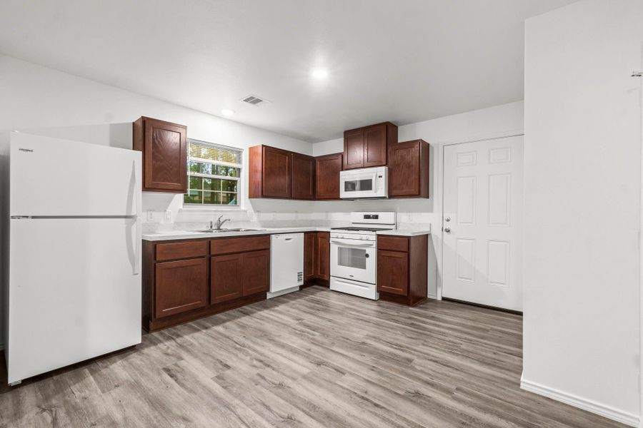 The kitchen is equipped with all-new appliances, and a large window above the sink that offers great natural light. The kitchen is equipped with all-new appliances, and a large window above the sink that offers great natural light.
