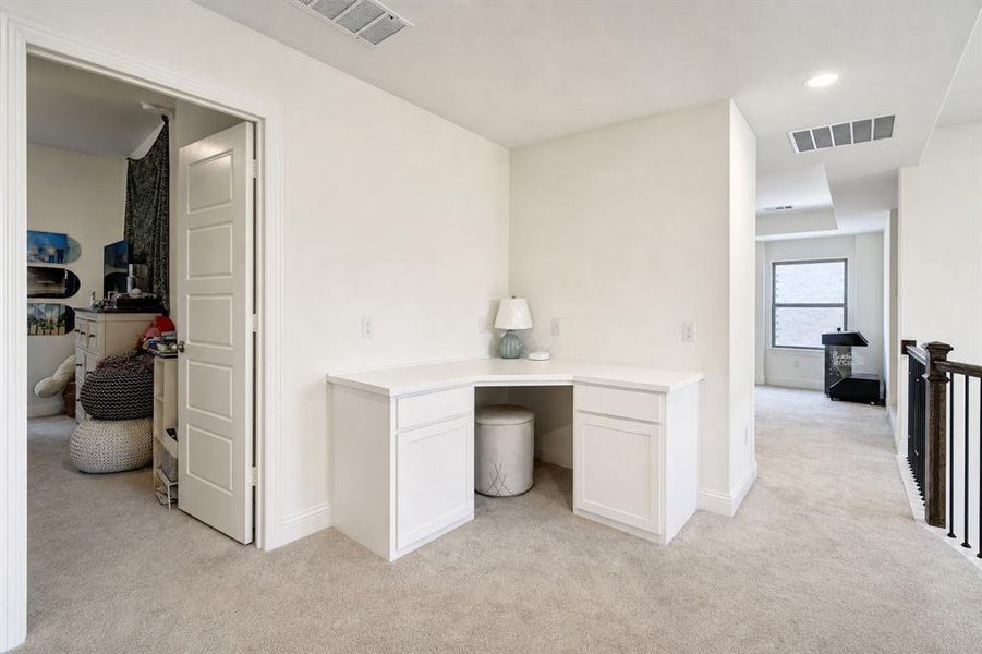 A study nook with built-in desk is just outside the upstairs bedrooms.