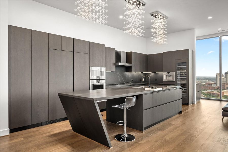 Chefs kitchen includes Pedini cabinets, illuminated drawers and island bar.