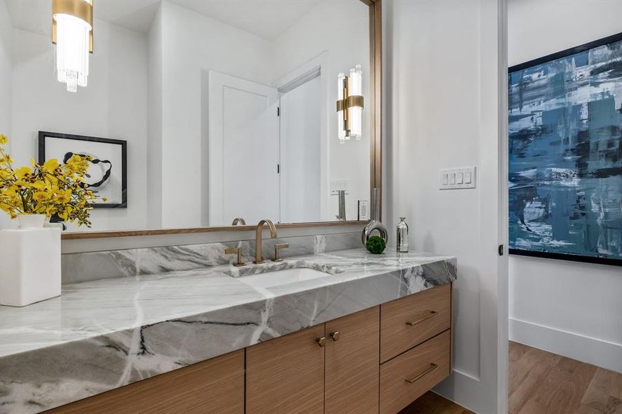 Bathroom with vanity and wood-type flooring