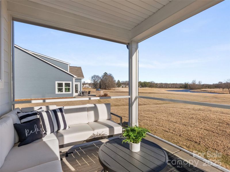 Exterior details and patio area of a home in Stonebridge Fairways, Monroe (Image 24).