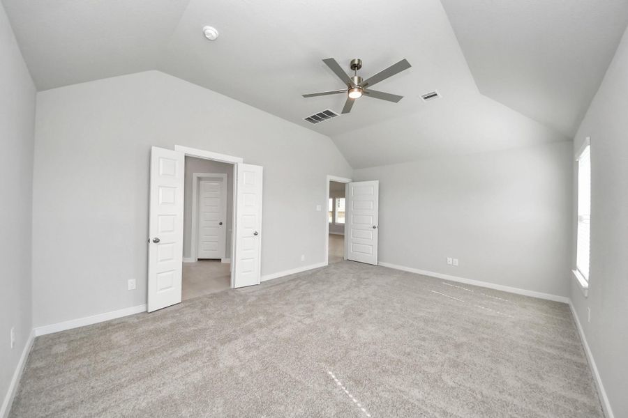 Escape and relax in the exquisite primary suite, a haven to unwind after a long day. The spacious room, boasts plush carpeting, soothing paint tones, high ceilings, and expansive windows adorned with privacy blinds. Sample photo of completed home with similar floor plan. Actual colors and selections may vary. Escape and relax in the exquisite primary suite, a haven to unwind after a long day. The spacious room, boasts plush carpeting, soothing paint tones, high ceilings, and expansive windows adorned with privacy blinds. Sample photo of completed home with similar floor plan. Actual colors and selections may vary.