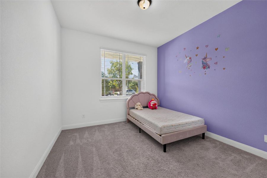 Plush carpet flooring pairs with natural light streaming through a multi-pane window. Plush carpet flooring pairs with natural light streaming through a multi-pane window.