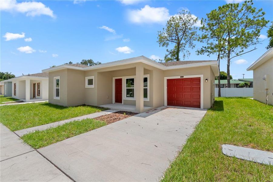 Front exterior of a new home in , Tampa, FL, highlighting curb appeal (Image 24). Front exterior of a new home in , Tampa, FL, highlighting curb appeal (Image 24).