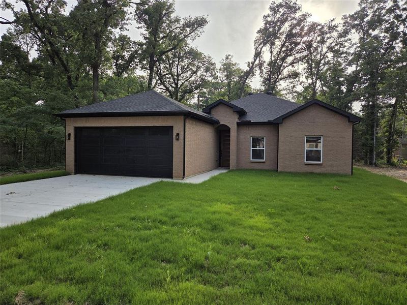 Front exterior of a new home in , Trinidad, TX, highlighting curb appeal (Image 19).