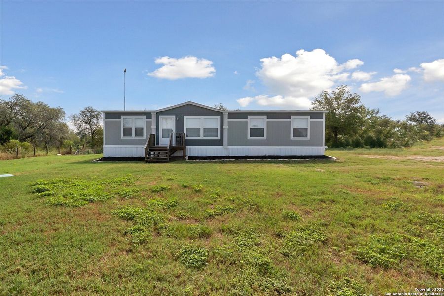 Front exterior of a new home in , Somerset, TX, highlighting curb appeal (Image 2). Front exterior of a new home in , Somerset, TX, highlighting curb appeal (Image 2).