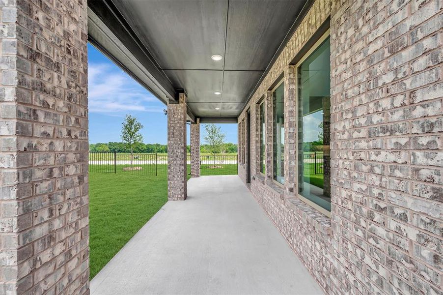 Exterior details and patio area of a home in Lily Creek at Sutton Fields, Aubrey (Image 21). Exterior details and patio area of a home in Lily Creek at Sutton Fields, Aubrey (Image 21).