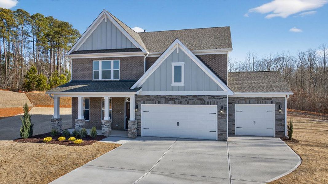 Front exterior of a new home in The Manors at Winston Pointe, Clayton, NC, highlighting curb appeal (Image 20).