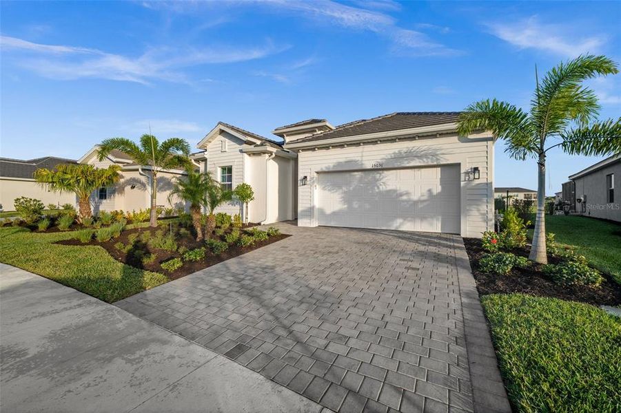 Front exterior of a new home in , Punta Gorda, FL, highlighting curb appeal (Image 2).