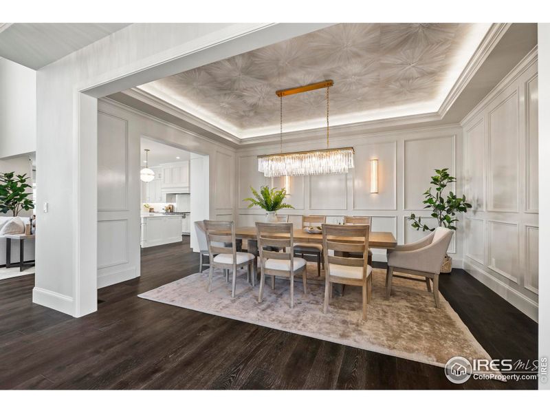 Formal Dining Room with Custom Light Fixtures and Hand Painted Ceiling that is spacious and impressive for any formal gathering
