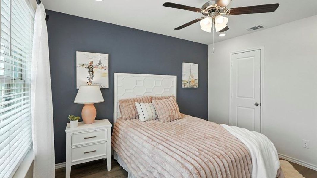 Bedroom with wood finished floors, ceiling fan, and recessed lighting Bedroom with wood finished floors, ceiling fan, and recessed lighting