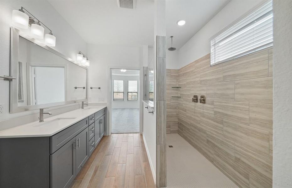 Furnished interior view inside a new home in Sunterra, Katy (Image 9).