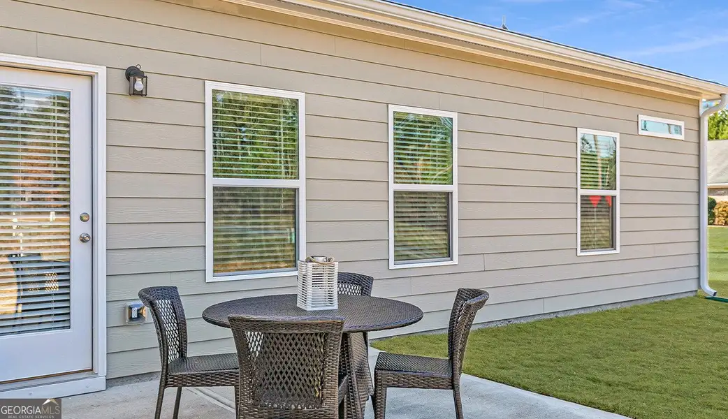 Exterior details and patio area of a home in The Cottages of Silvertown, Thomaston (Image 3).