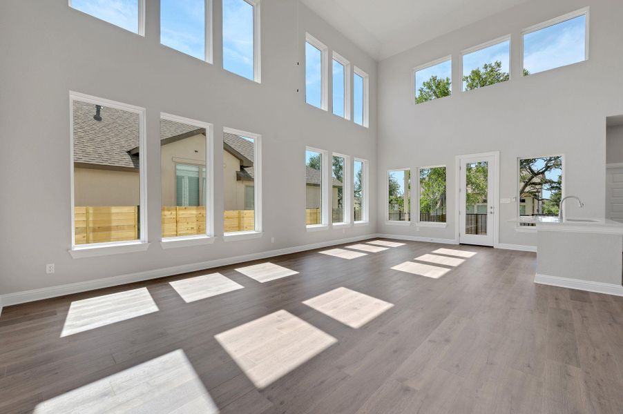 Unfurnished living room with wood finished floors