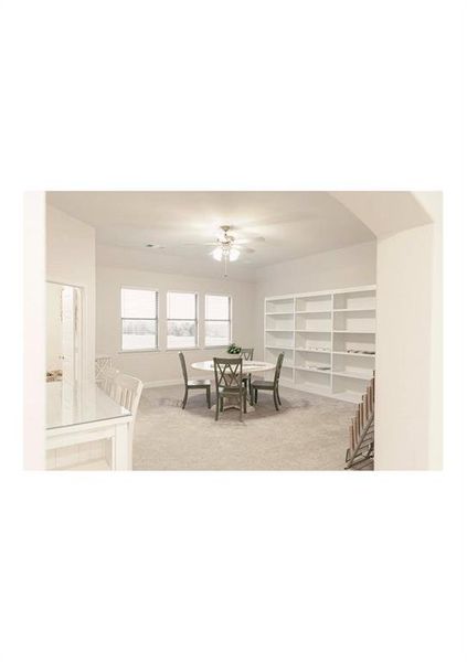 Carpeted dining room with ceiling fan