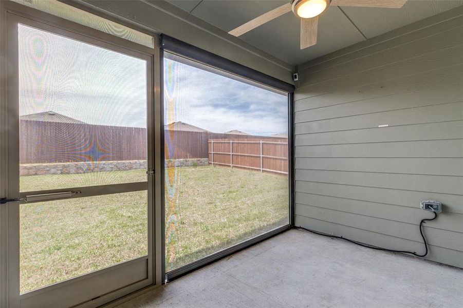Screened patio featuring a concrete floor and horizontal siding Screened patio featuring a concrete floor and horizontal siding