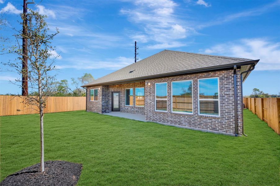 Exterior details and patio area of a home in Meridiana 55' Homesites, Manvel (Image 4).