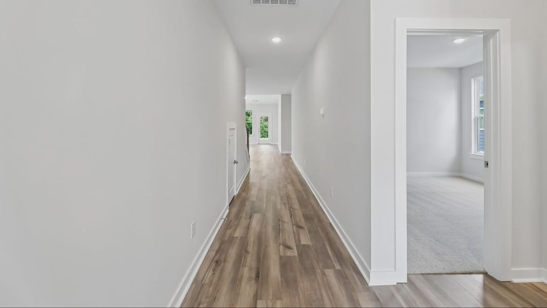 Hallway with view into bedroom
