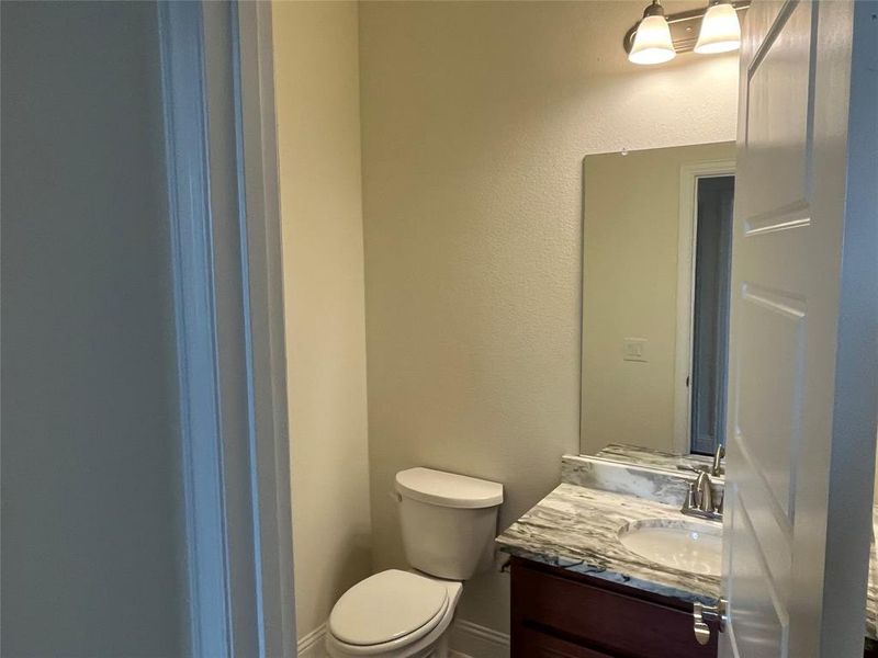 Bathroom featuring toilet and vanity