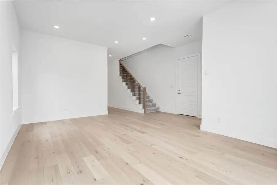 Unfurnished living room with light wood-type flooring