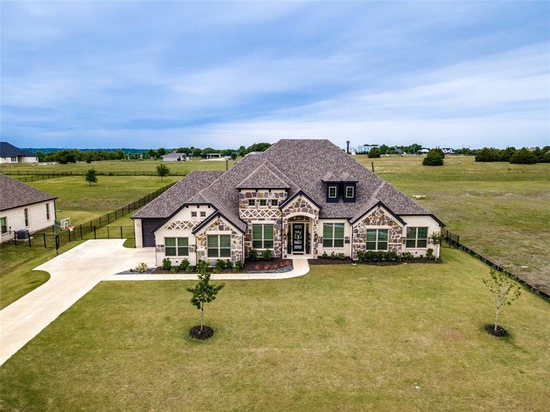 Front exterior of a new home in , McLendon-Chisholm, TX, highlighting curb appeal (Image 20). Front exterior of a new home in , McLendon-Chisholm, TX, highlighting curb appeal (Image 20).