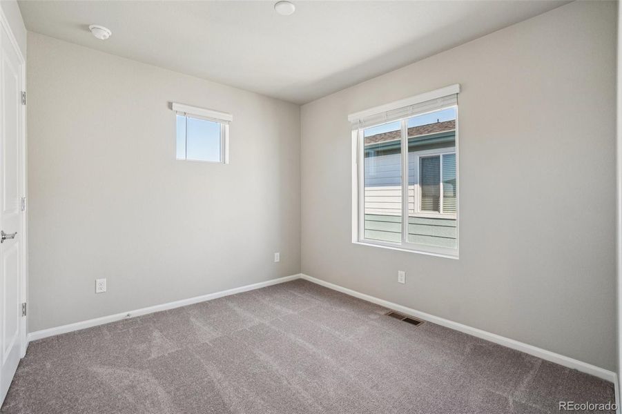 Spacious, unfurnished interior of a new home in Woodrose at Painted Prairie, Aurora (Image 18).