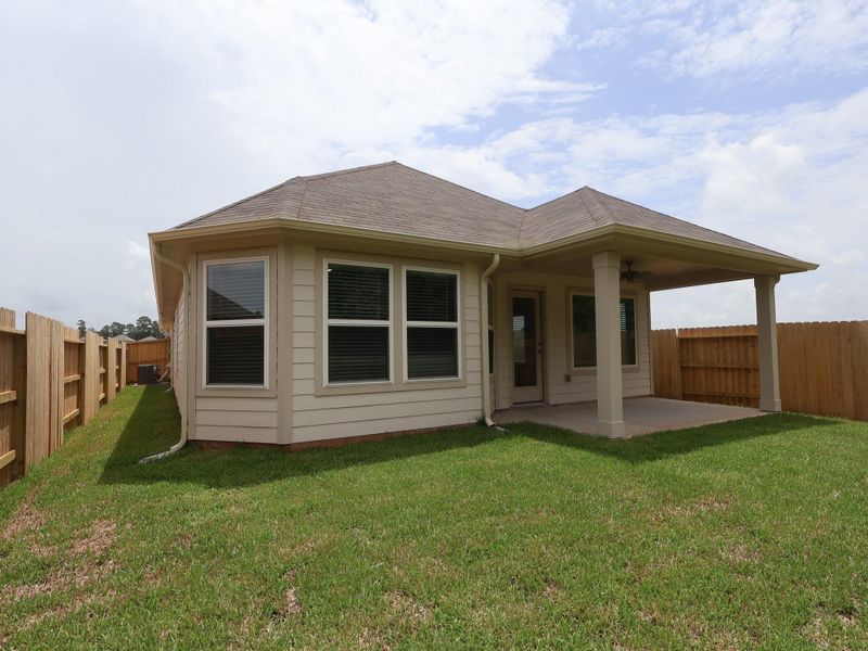 Exterior details and patio area of a home in Lone Star Landing, Montgomery (Image 3). Exterior details and patio area of a home in Lone Star Landing, Montgomery (Image 3).
