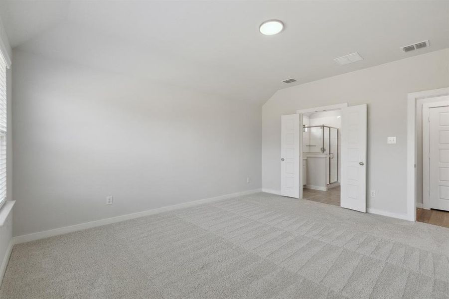 Primary Suite in the Heisman home plan by Trophy Signature Homes – REPRESENTATIVE PHOTO