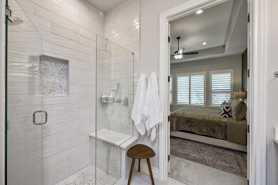 Ensuite primary bathroom featuring a shower stall, a ceiling fan, and recessed lighting Ensuite primary bathroom featuring a shower stall, a ceiling fan, and recessed lighting