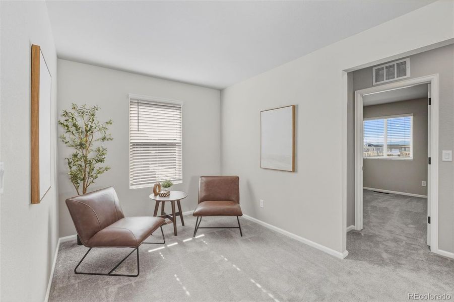 Furnished interior view inside a new home in Woodrose at Painted Prairie, Aurora (Image 4).
